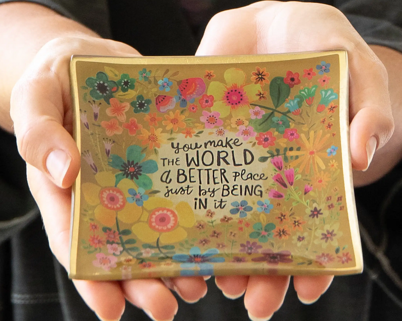 Hand holding a Trinket Dish that says - You make the world a better place just by being in it.